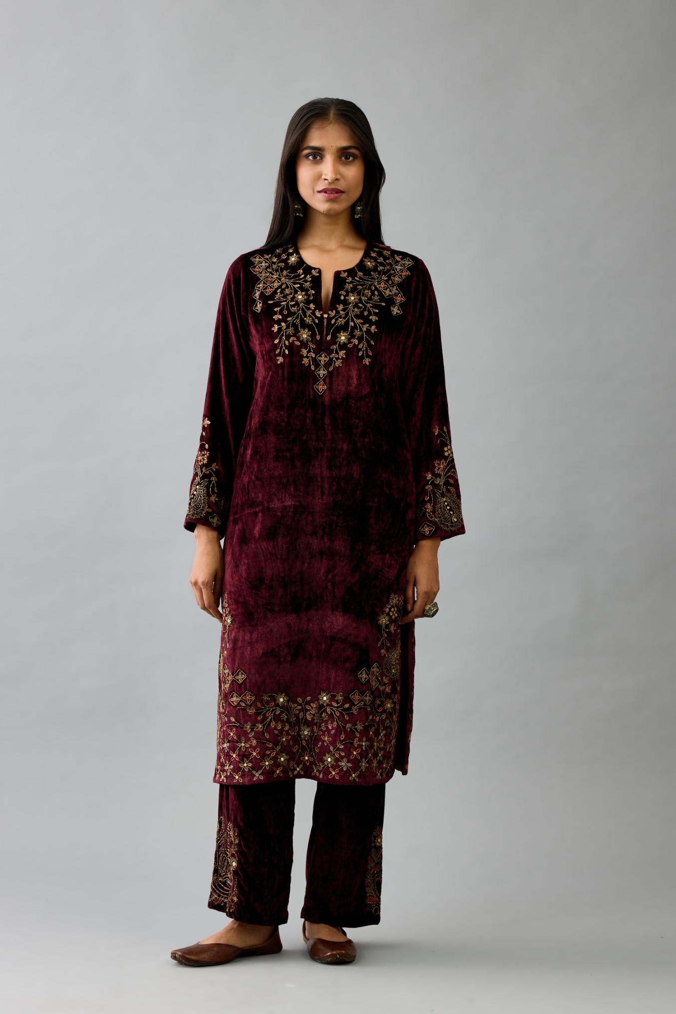 Maroon silk velvet straight mid length kurta with all-over hand block print, highlighted with beads, sequins and zari work at neck & hem.
