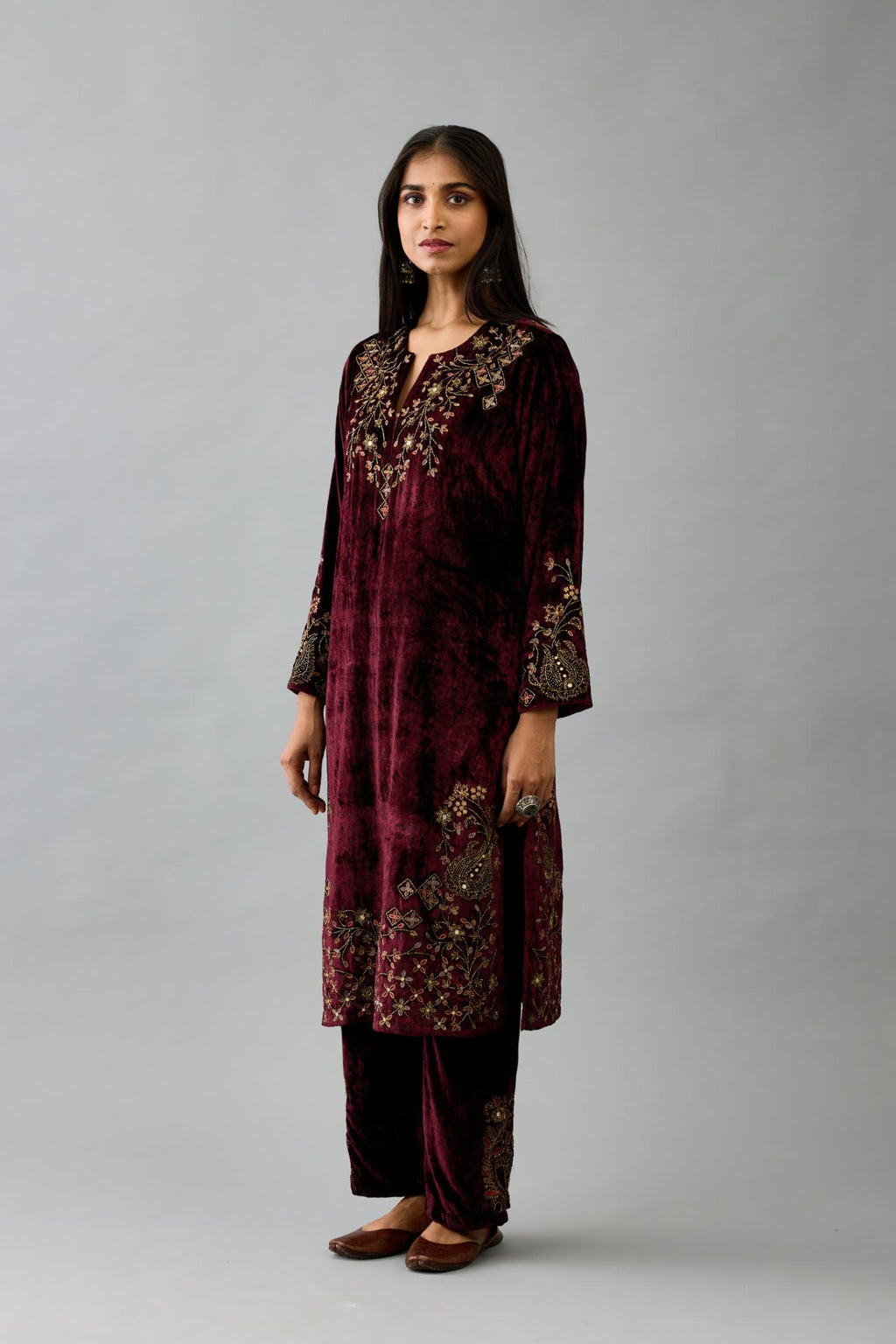 Maroon silk velvet straight mid length kurta with all-over hand block print, highlighted with beads, sequins and zari work at neck & hem.