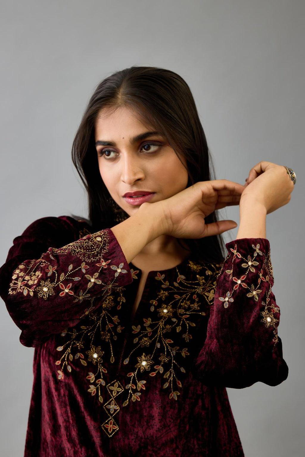Maroon silk velvet straight mid length kurta with all-over hand block print, highlighted with beads, sequins and zari work at neck & hem.