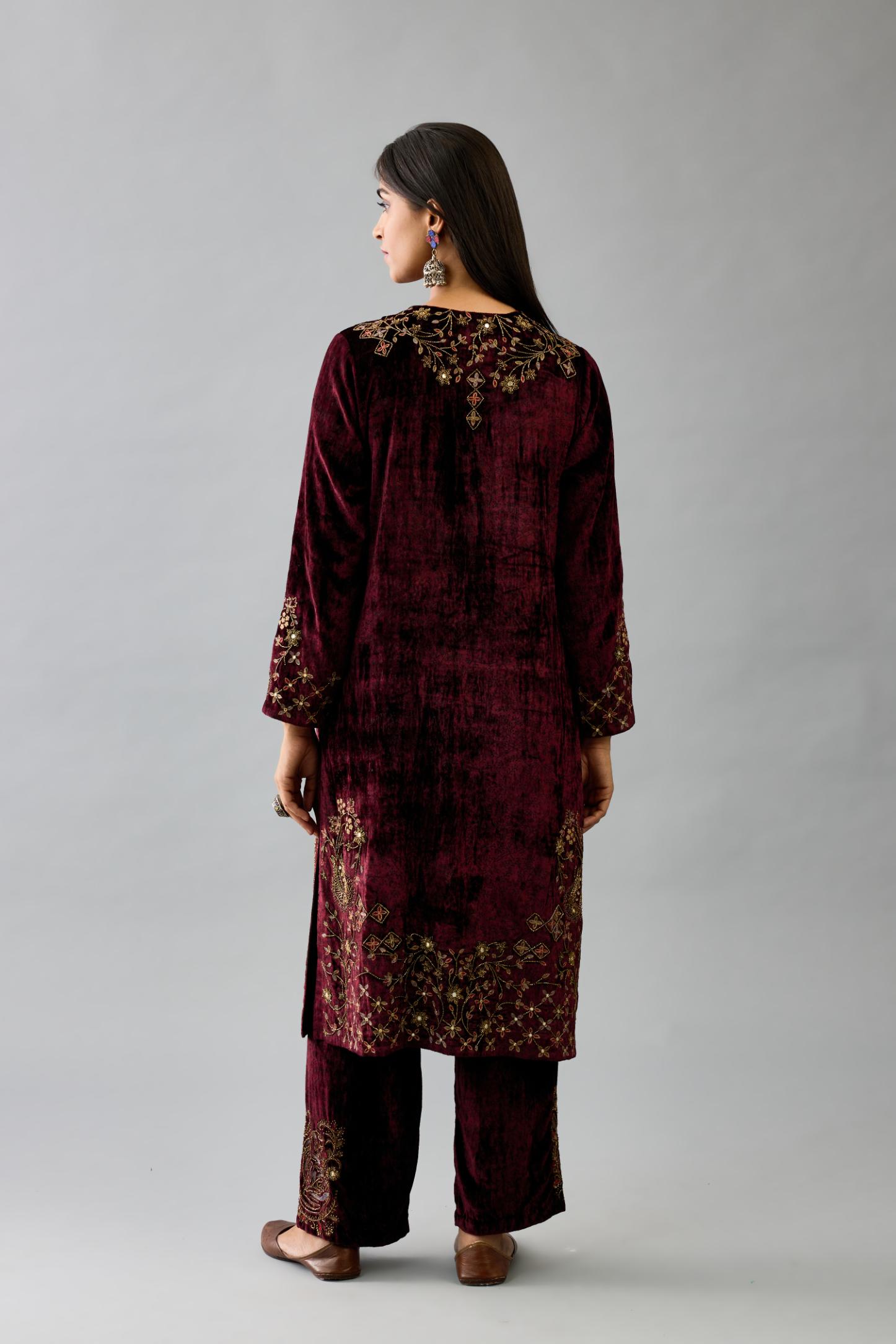 Maroon silk velvet straight mid length kurta with all-over hand block print, highlighted with beads, sequins and zari work at neck & hem.