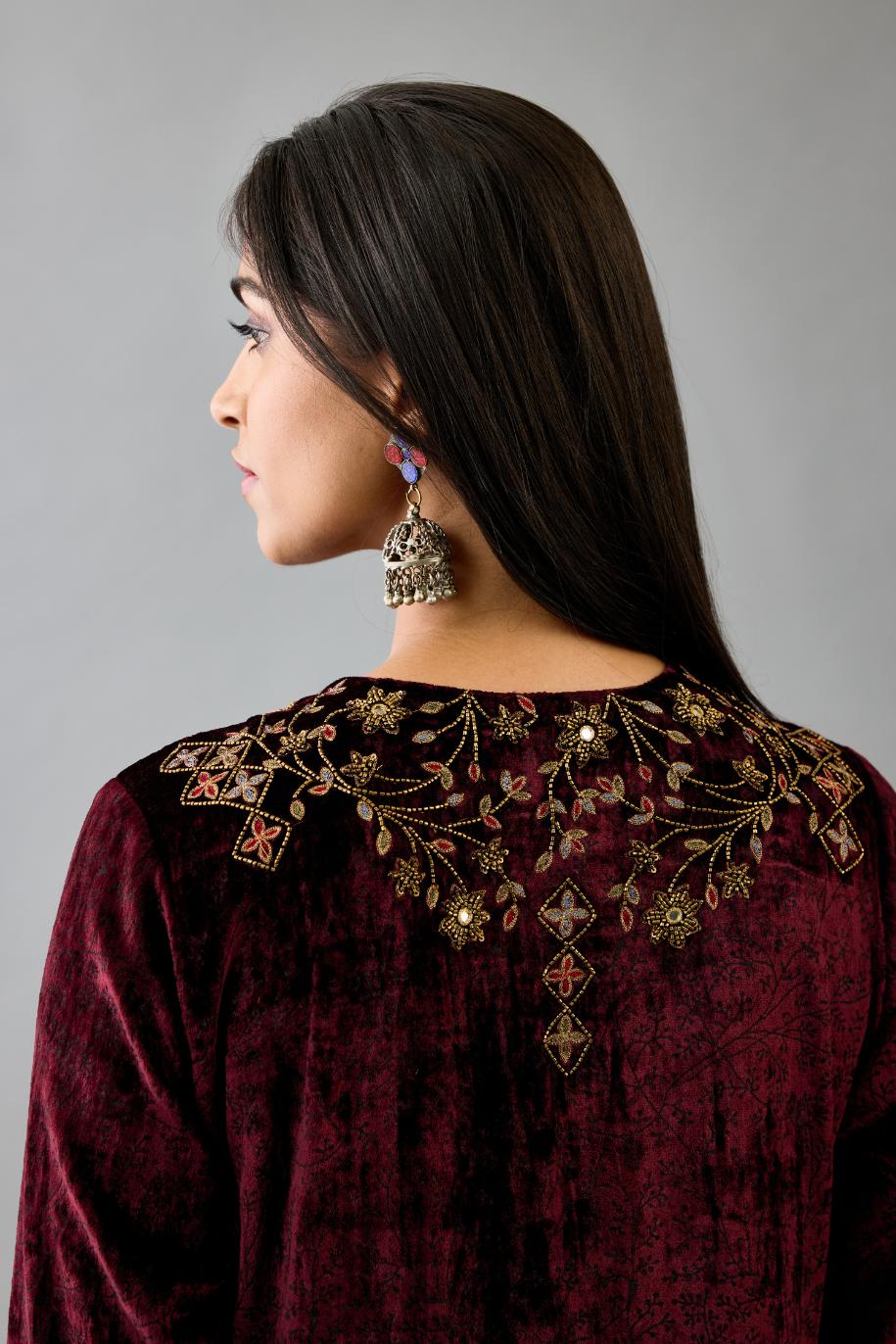 Maroon silk velvet straight mid length kurta with all-over hand block print, highlighted with beads, sequins and zari work at neck & hem.