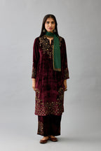 Maroon silk velvet straight mid length kurta with all-over hand block print, highlighted with beads, sequins and zari work at neck & hem.