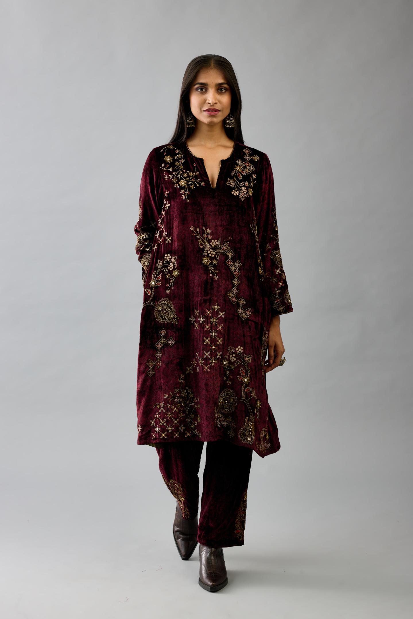 Maroon silk velvet short easy fit kurta set with straight hem and all-over hand block print, highlighted with beads, sequins and zari work.