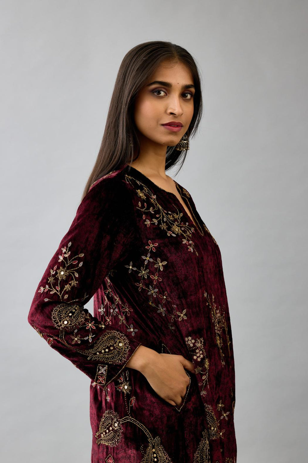 Maroon silk velvet short easy fit kurta set with straight hem and all-over hand block print, highlighted with beads, sequins and zari work.