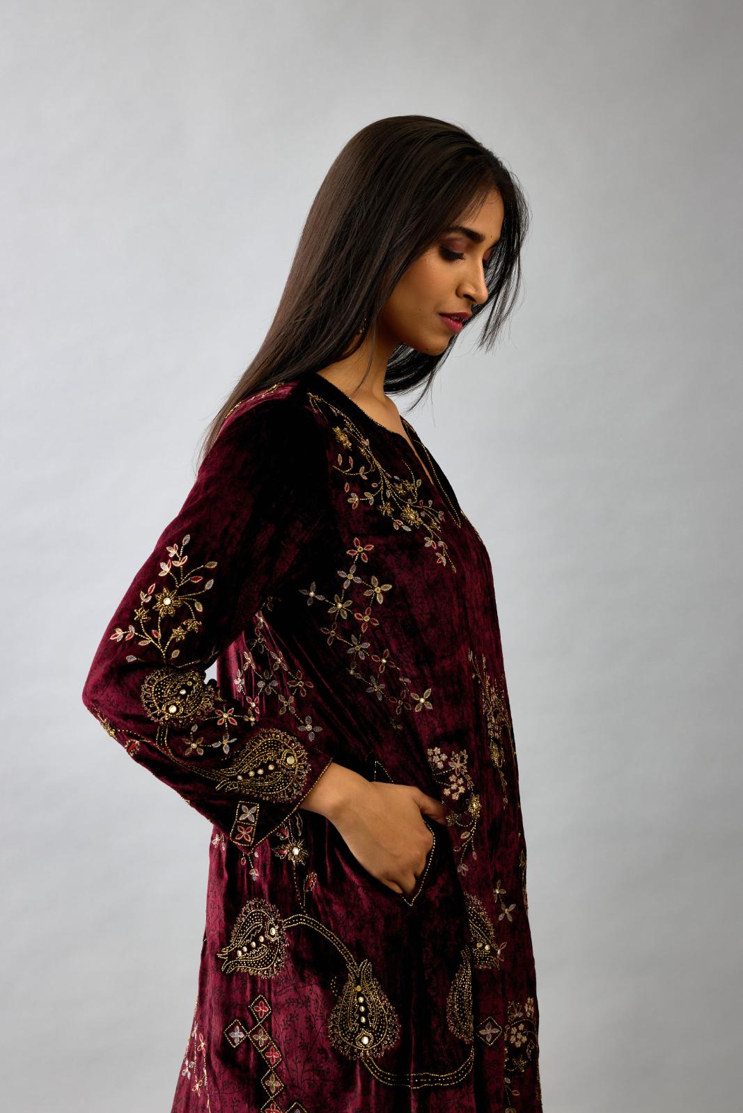 Maroon silk velvet short easy fit kurta set with straight hem and all-over hand block print, highlighted with beads, sequins and zari work.