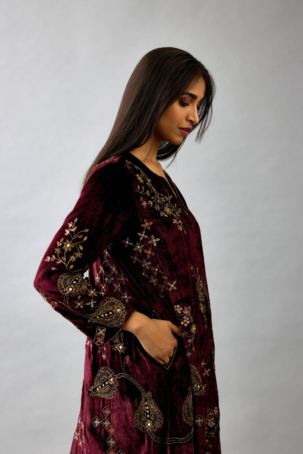 Maroon silk velvet short easy fit kurta set with straight hem and all-over hand block print, highlighted with beads, sequins and zari work.