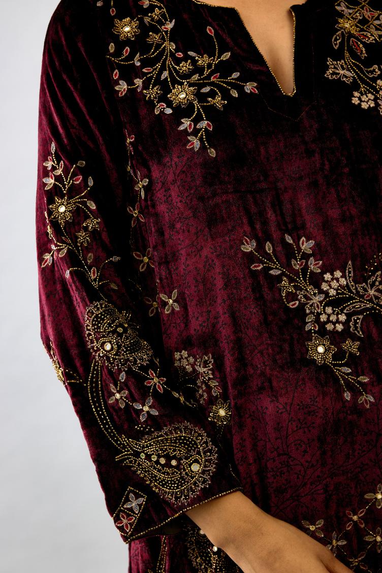 Maroon silk velvet short easy fit kurta set with straight hem and all-over hand block print, highlighted with beads, sequins and zari work.