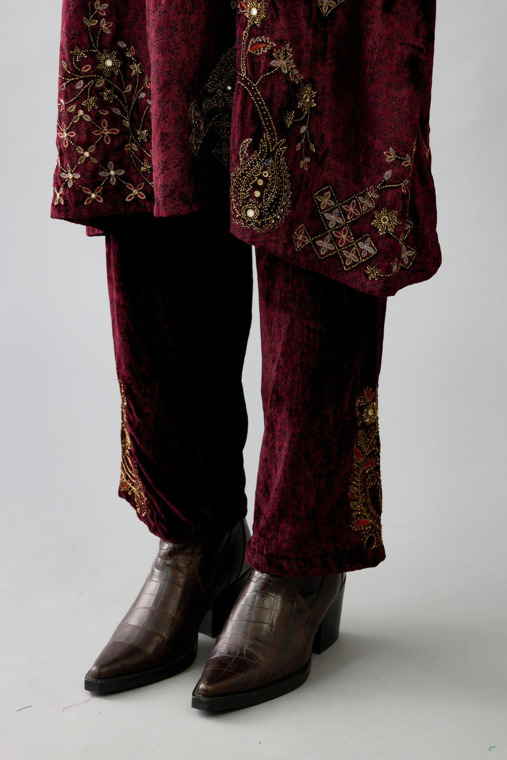 Maroon silk velvet short easy fit kurta set with straight hem and all-over hand block print, highlighted with beads, sequins and zari work.