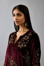 Maroon silk velvet short easy fit kurta set with straight hem and all-over hand block print, highlighted with beads, sequins and zari work.