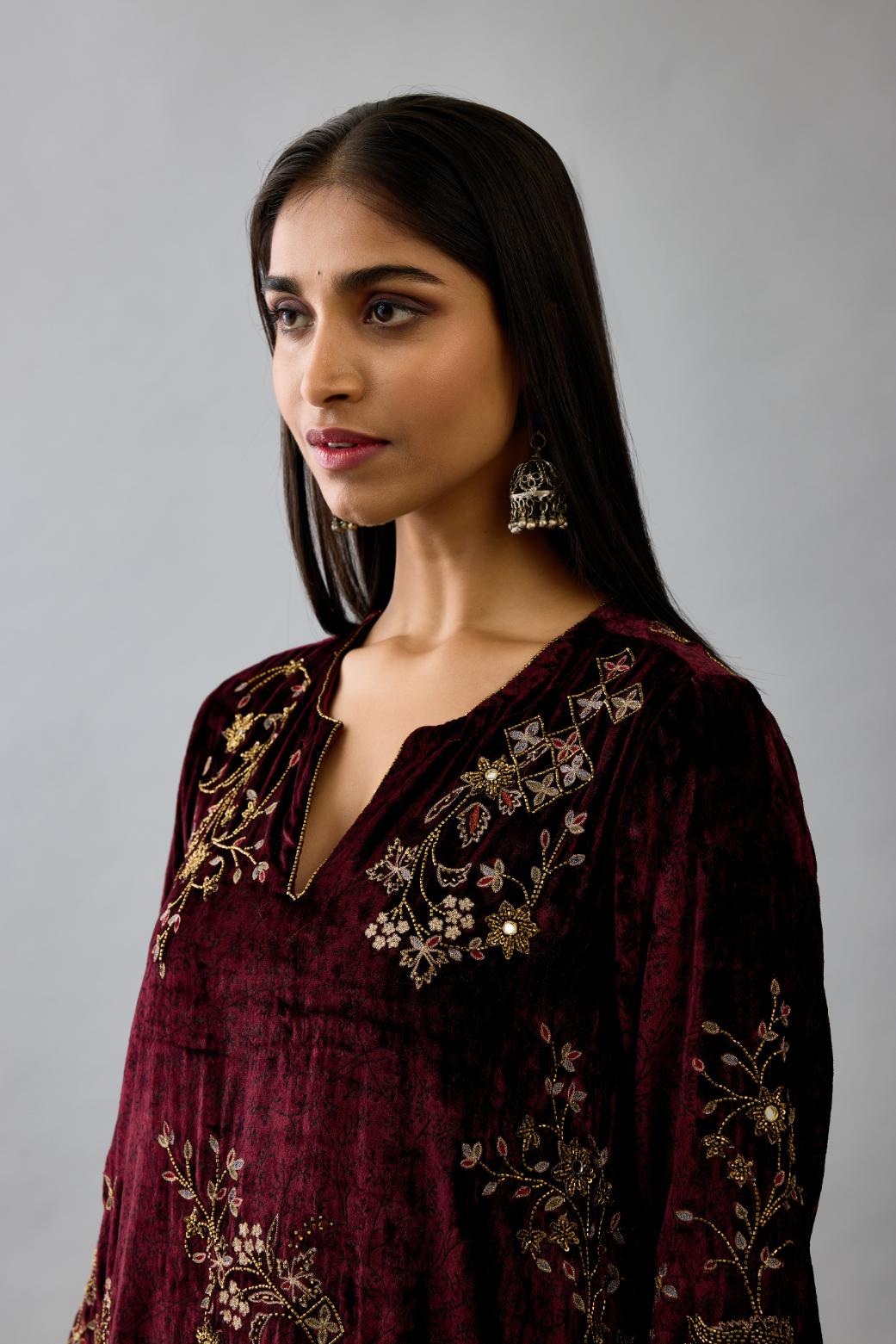 Maroon silk velvet short easy fit kurta set with straight hem and all-over hand block print, highlighted with beads, sequins and zari work.