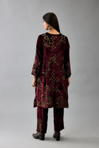 Maroon silk velvet short easy fit kurta set with straight hem and all-over hand block print, highlighted with beads, sequins and zari work.