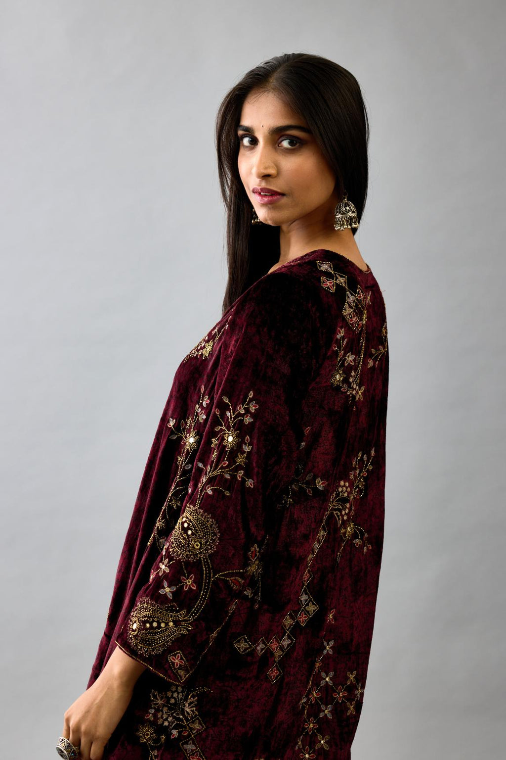 Maroon silk velvet short easy fit kurta set with straight hem and all-over hand block print, highlighted with beads, sequins and zari work.