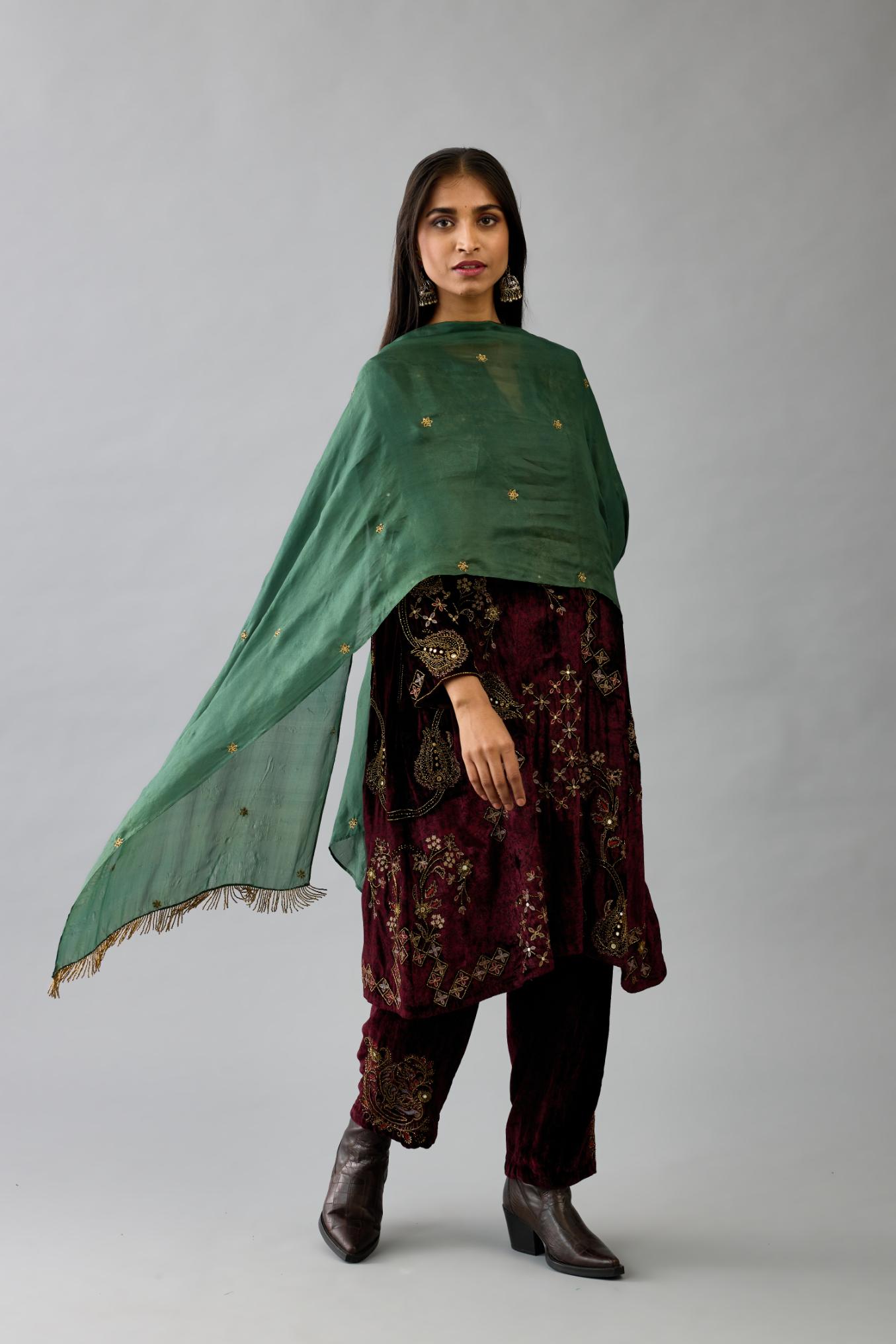 Maroon silk velvet short easy fit kurta set with straight hem and all-over hand block print, highlighted with beads, sequins and zari work.