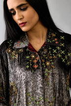 Grey silk velvet shirt with all-over hand block print, highlighted with sequins, beads and zari work, paired with grey silk velvet hand block printed straight pants with embroidered boota at sides, highlighted with sequins, beads and zari work.