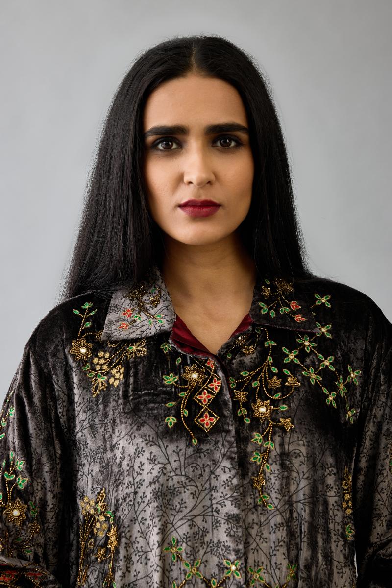 Grey silk velvet shirt with all-over hand block print, highlighted with sequins, beads and zari work, paired with grey silk velvet hand block printed straight pants with embroidered boota at sides, highlighted with sequins, beads and zari work.