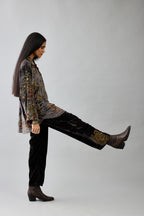 Grey silk velvet shirt with all-over hand block print, highlighted with sequins, beads and zari work, paired with grey silk velvet hand block printed straight pants with embroidered boota at sides, highlighted with sequins, beads and zari work.