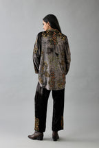 Grey silk velvet shirt with all-over hand block print, highlighted with sequins, beads and zari work, paired with grey silk velvet hand block printed straight pants with embroidered boota at sides, highlighted with sequins, beads and zari work.