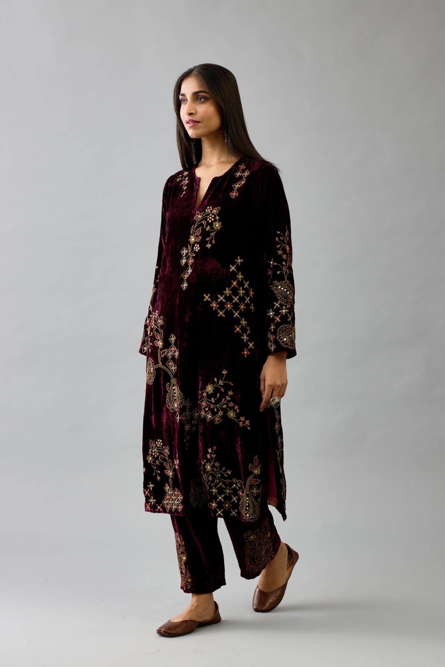 Maroon silk velvet straight mid length kurta with all-over hand block print, highlighted with beads, sequins and zari work.