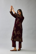 Maroon silk velvet straight mid length kurta with all-over hand block print, highlighted with beads, sequins and zari work.