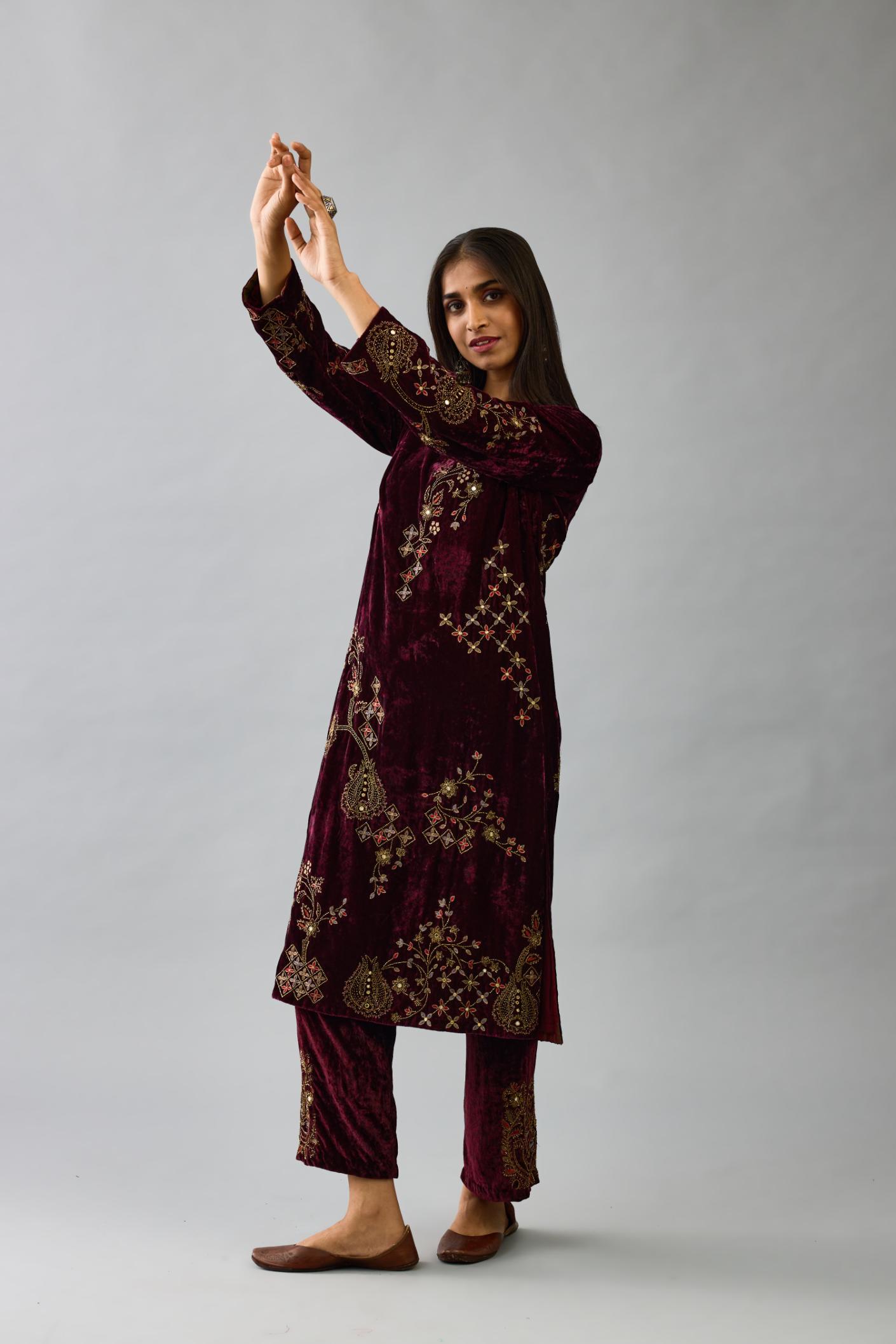Maroon silk velvet straight mid length kurta with all-over hand block print, highlighted with beads, sequins and zari work.