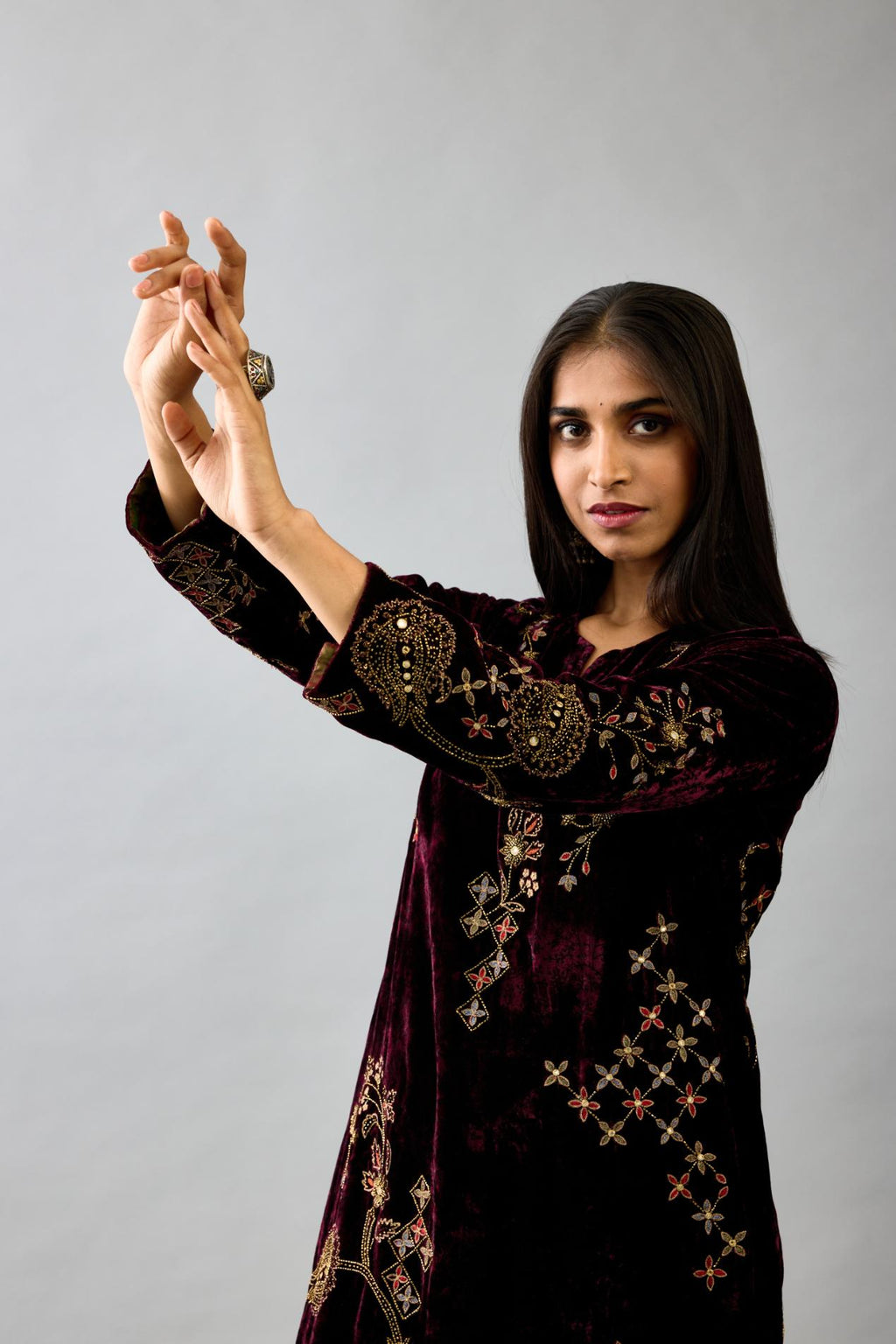 Maroon silk velvet straight mid length kurta with all-over hand block print, highlighted with beads, sequins and zari work.