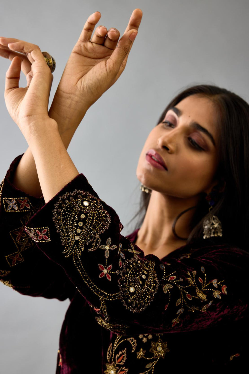 Maroon silk velvet straight mid length kurta with all-over hand block print, highlighted with beads, sequins and zari work.