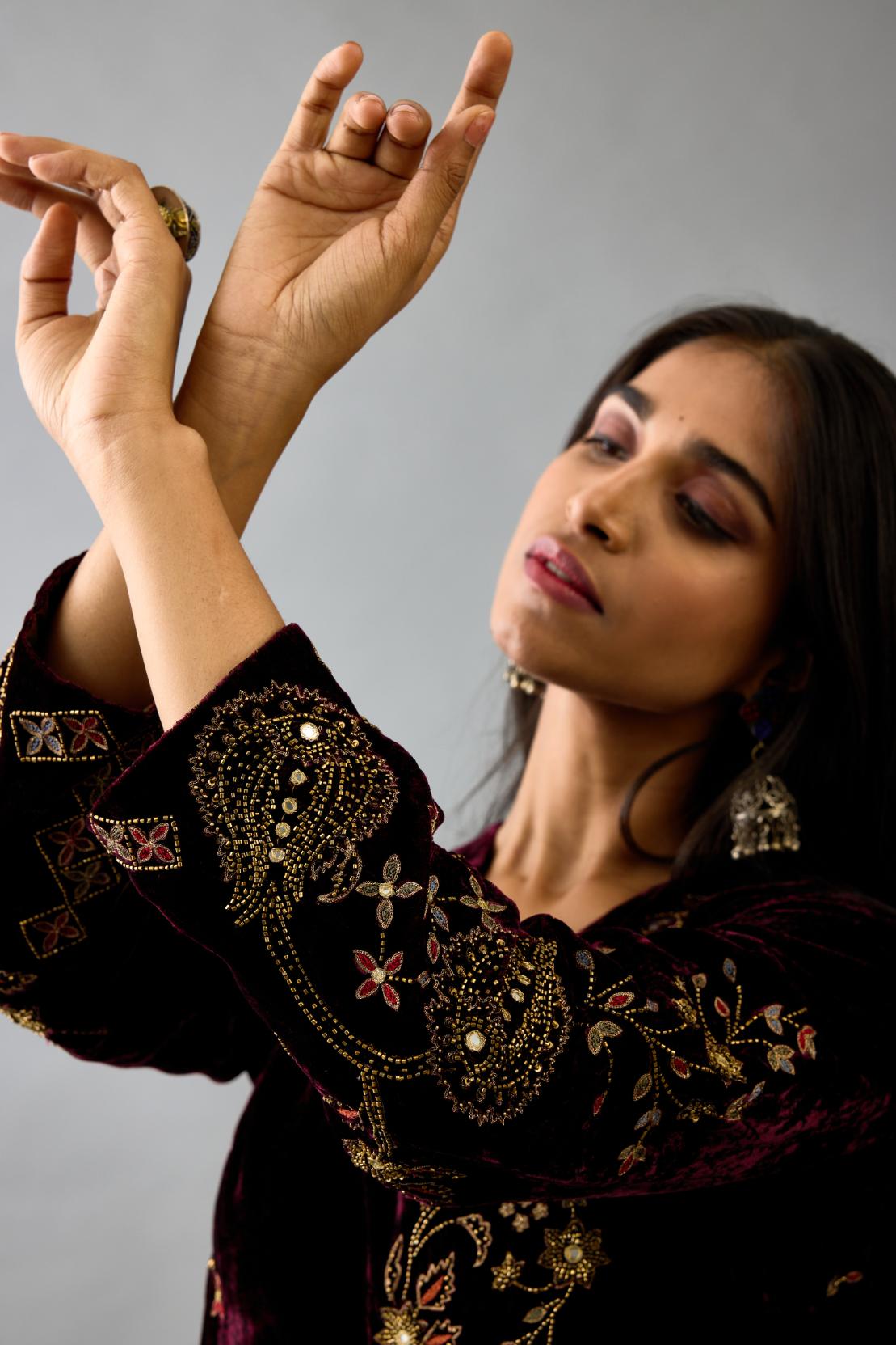 Maroon silk velvet straight mid length kurta with all-over hand block print, highlighted with beads, sequins and zari work.