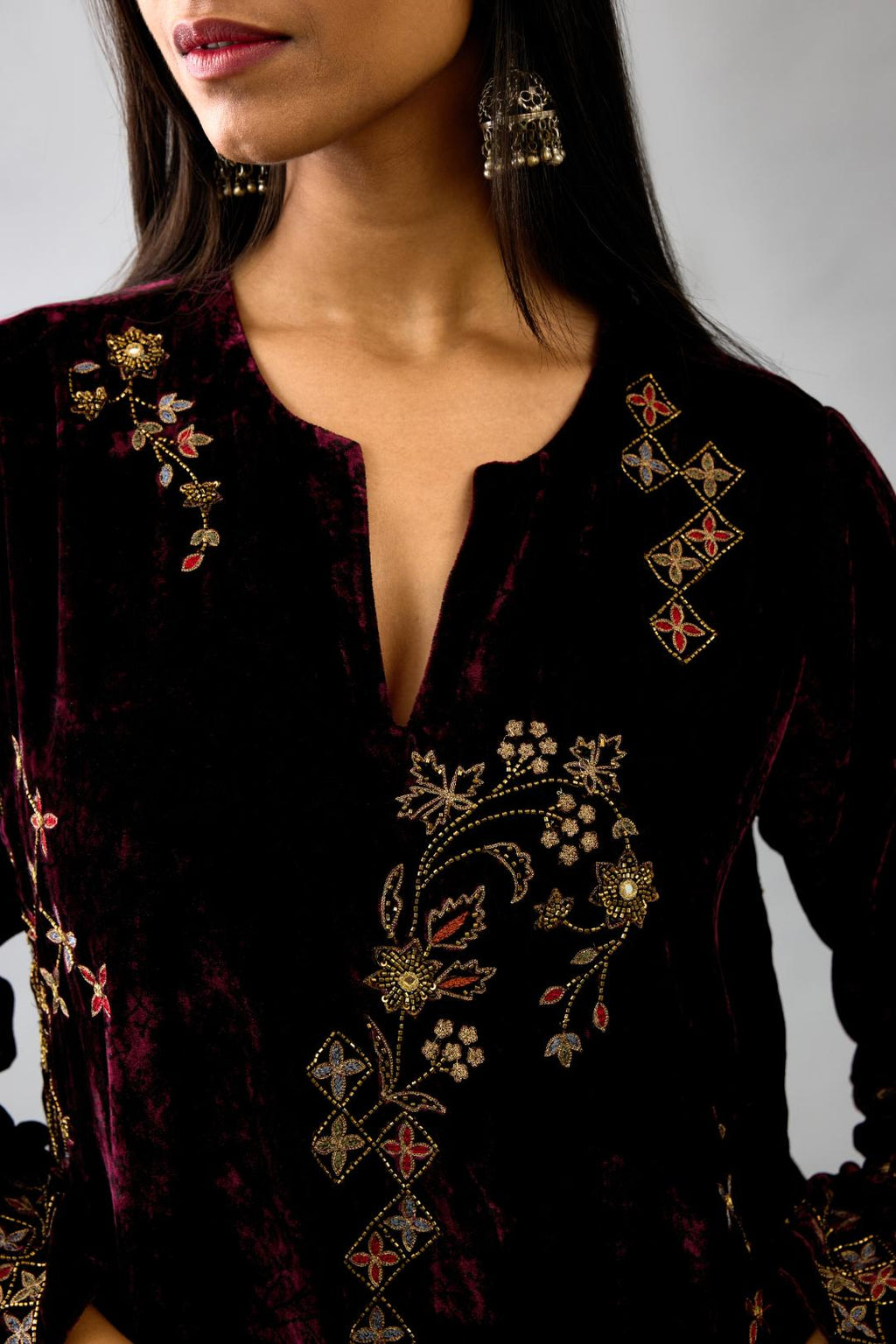 Maroon silk velvet straight mid length kurta with all-over hand block print, highlighted with beads, sequins and zari work.