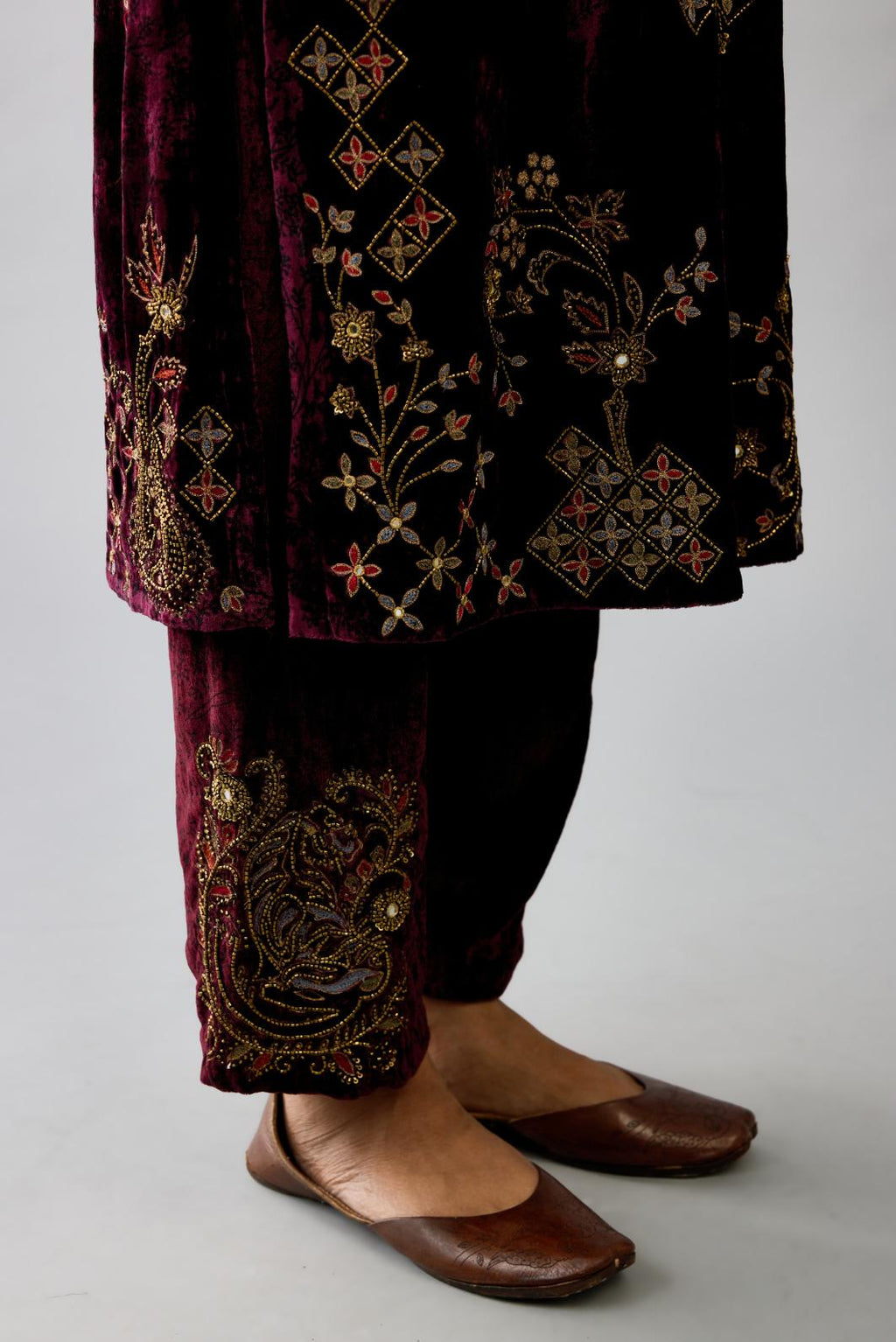 Maroon silk velvet straight mid length kurta with all-over hand block print, highlighted with beads, sequins and zari work.