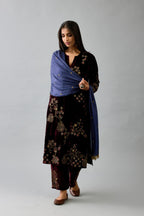Blue light silk stole with all-over small embroidered booti and fringes at sides.