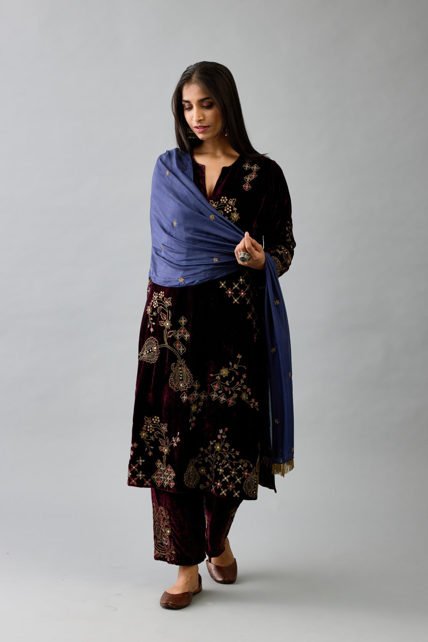 Maroon silk velvet straight mid length kurta with all-over hand block print, highlighted with beads, sequins and zari work.