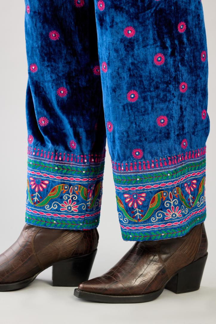 Blue silk velvet straight pants with all over contrast color embroidery detailed with sequins.