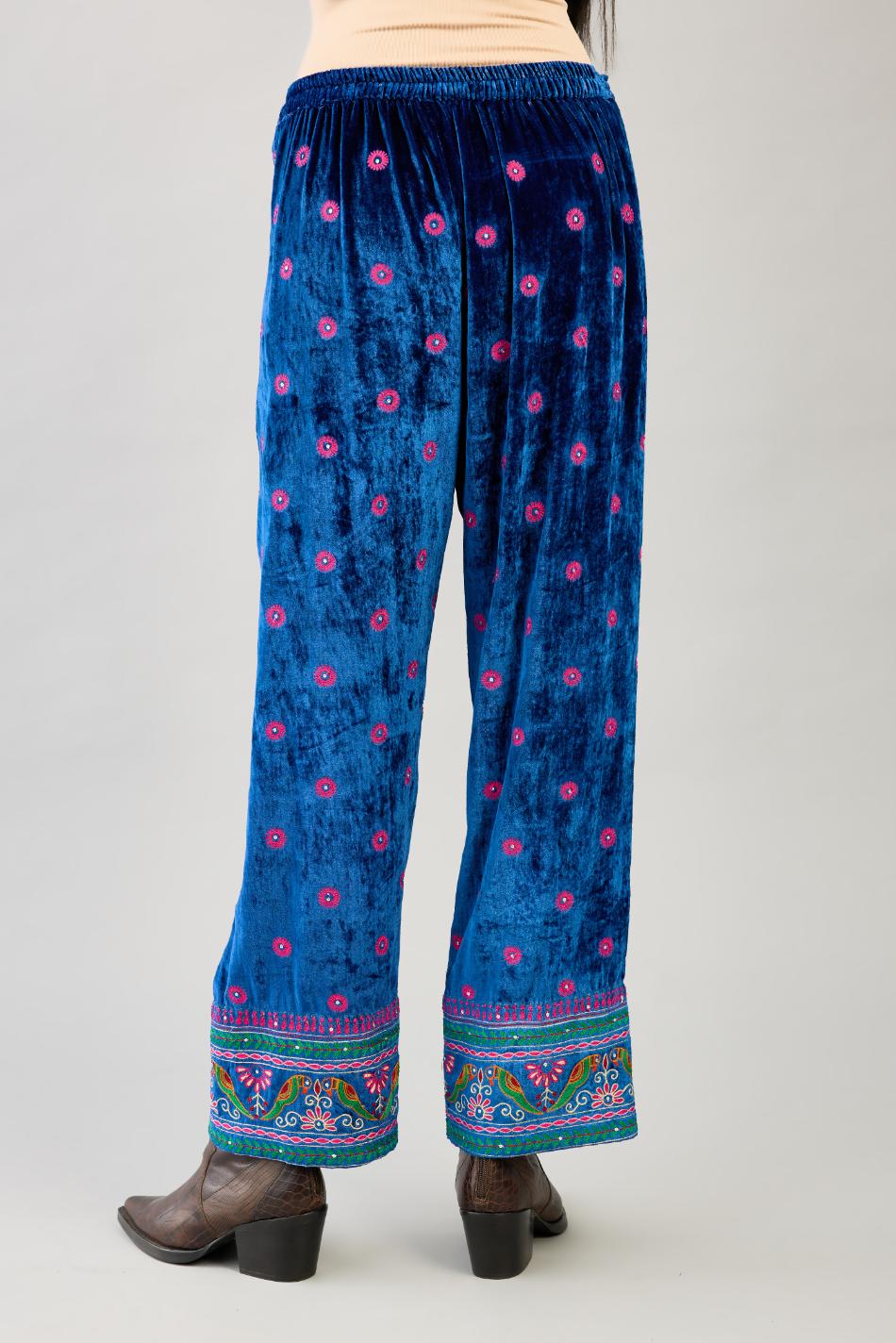 Blue silk velvet straight pants with all over contrast color embroidery detailed with sequins.