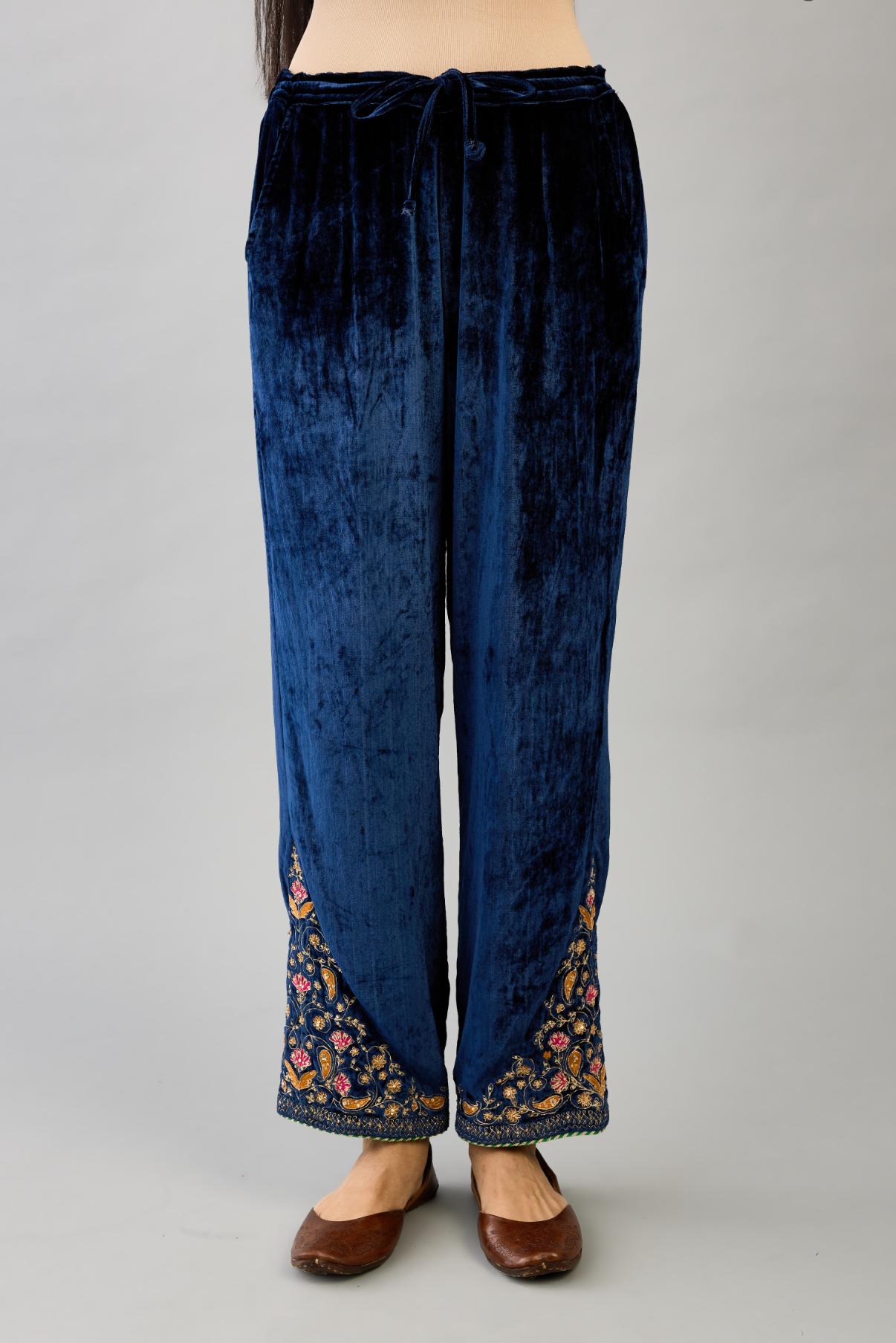 Blue silk velvet straight pants with dori and contrast silk thread embroidery, detailed with gold sequins work.