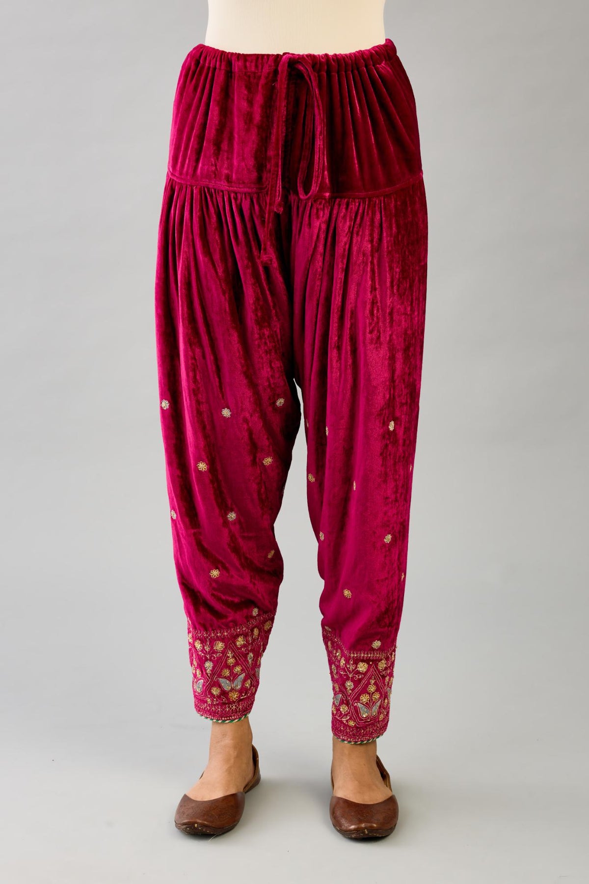 Fuchsia silk velvet narrow salwar with dori and contrast silk thread embroidery,  detailed with gold sequins work.