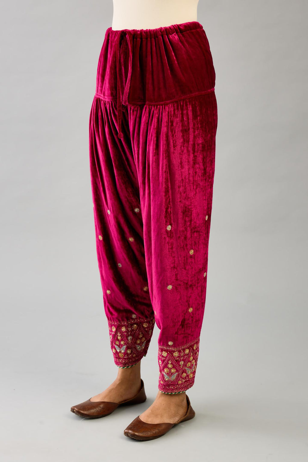 Fuchsia silk velvet narrow salwar with dori and contrast silk thread embroidery,  detailed with gold sequins work.