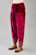 Fuchsia silk velvet narrow salwar with dori and contrast silk thread embroidery,  detailed with gold sequins work.