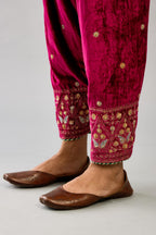 Fuchsia silk velvet narrow salwar with dori and contrast silk thread embroidery,  detailed with gold sequins work.