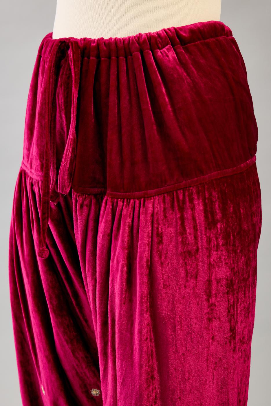 Fuchsia silk velvet narrow salwar with dori and contrast silk thread embroidery,  detailed with gold sequins work.