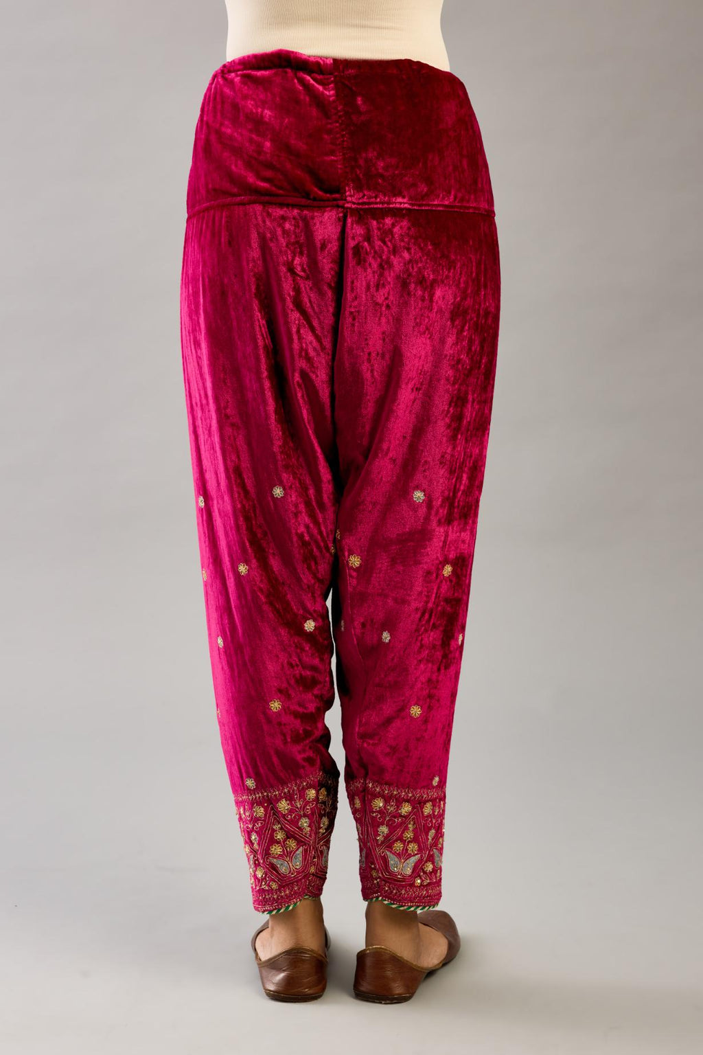 Fuchsia silk velvet narrow salwar with dori and contrast silk thread embroidery,  detailed with gold sequins work.