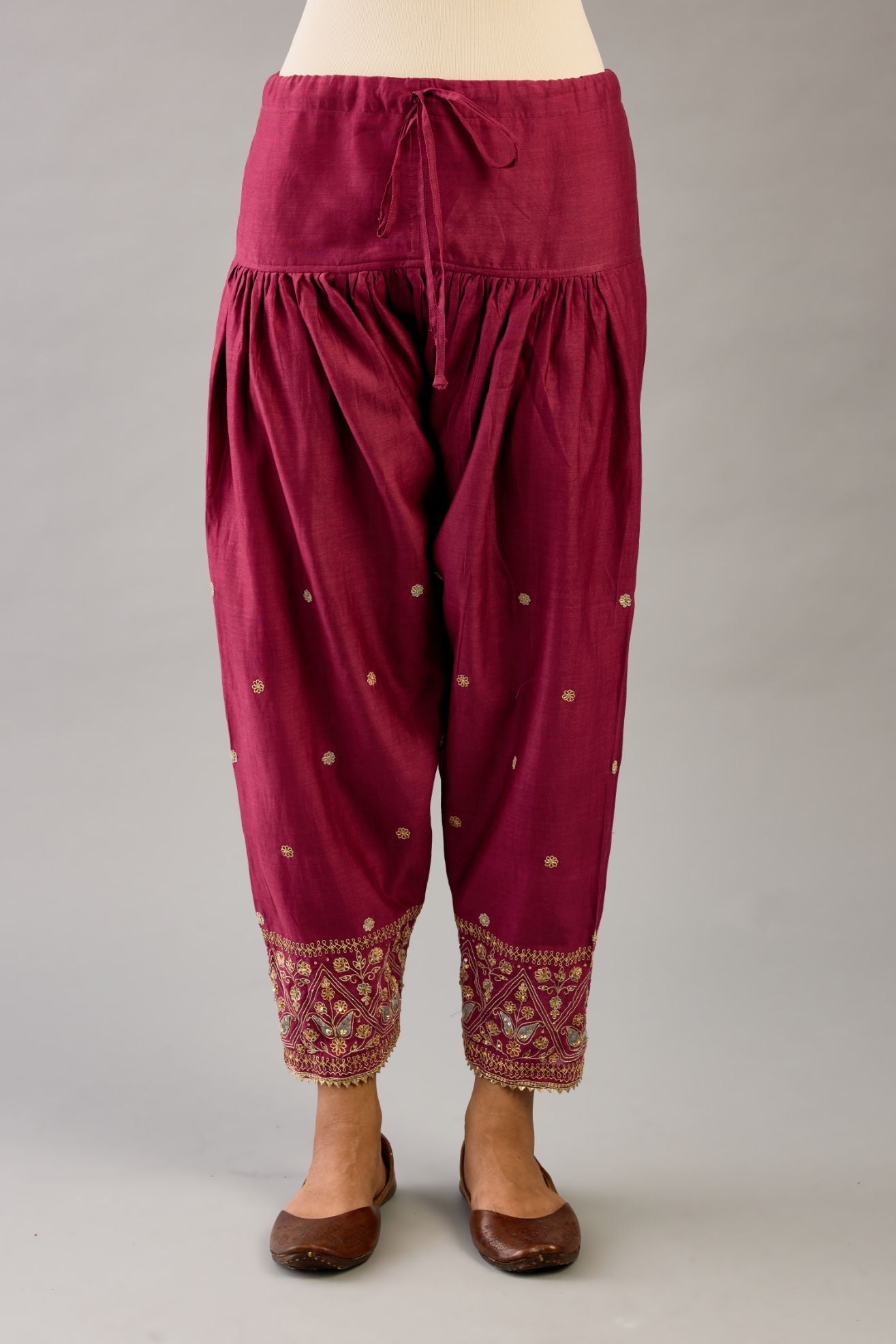 Wine silk chanderi narrow salwar with dori and contrast silk thread embroidery,  detailed with gold sequins work.