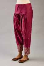 Wine silk chanderi narrow salwar with dori and contrast silk thread embroidery,  detailed with gold sequins work.