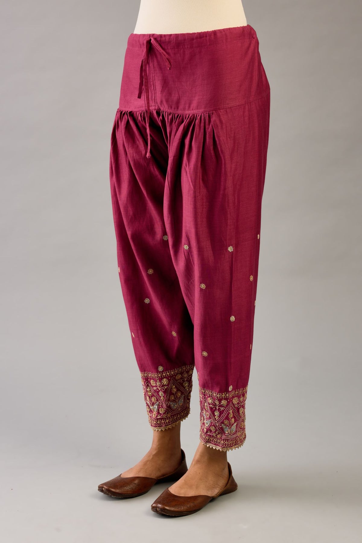 Wine silk chanderi narrow salwar with dori and contrast silk thread embroidery,  detailed with gold sequins work.