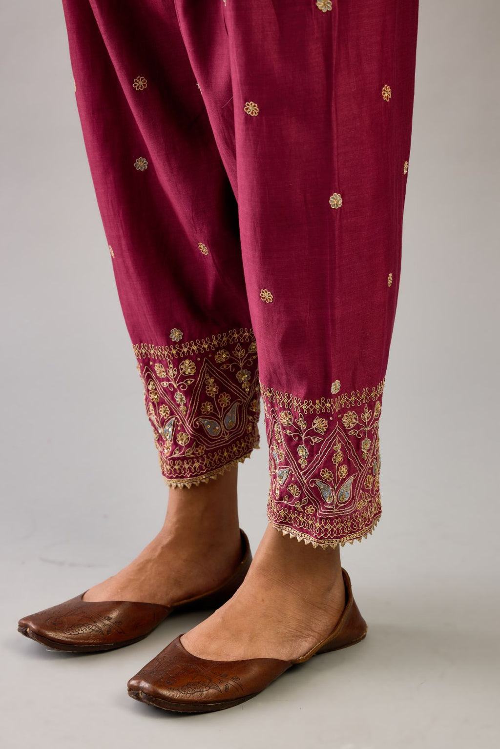 Wine silk chanderi narrow salwar with dori and contrast silk thread embroidery,  detailed with gold sequins work.