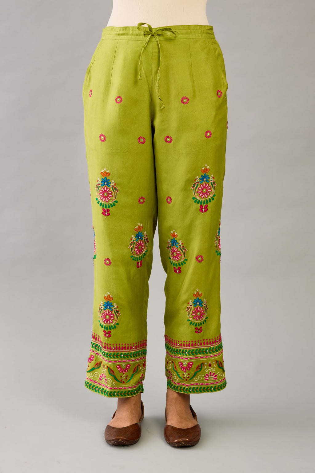 Apple green silk straight pants with all over multi color embroidery detailed with sequins.