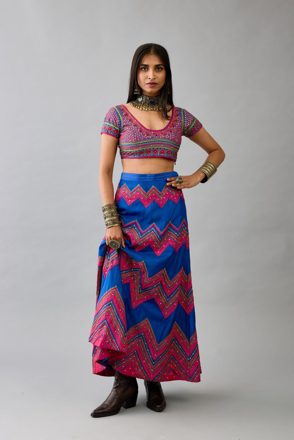 Blue silk embroidered choli set with deep round neck and princess seams.