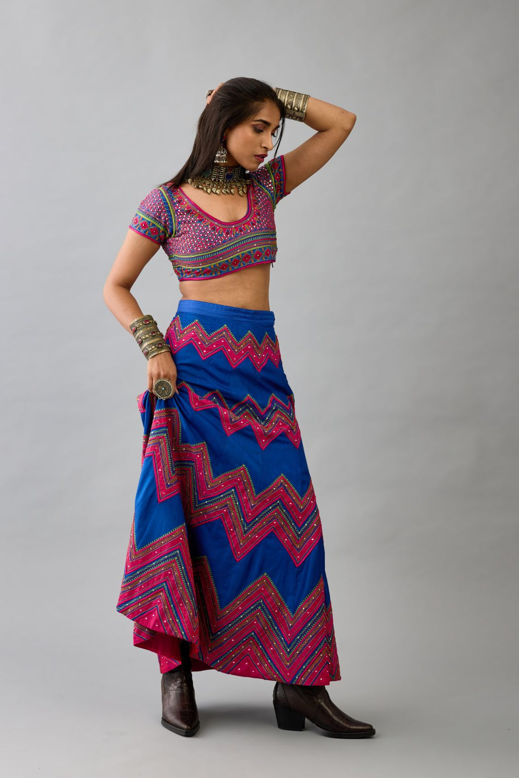 Blue silk embroidered choli set with deep round neck and princess seams.