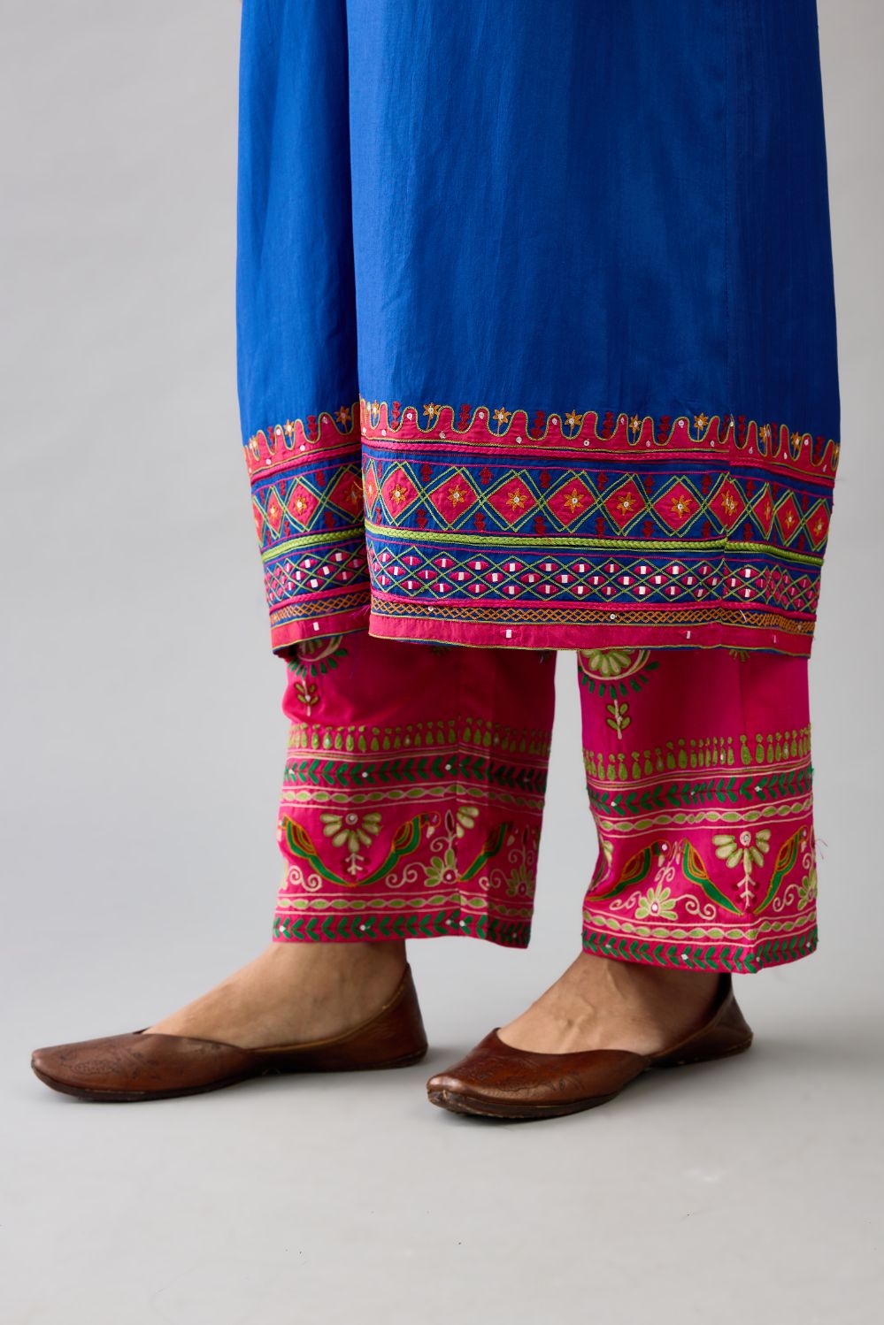 Blue silk embroidered kurta dress with V neck, yoke and fine gathers at empire line.