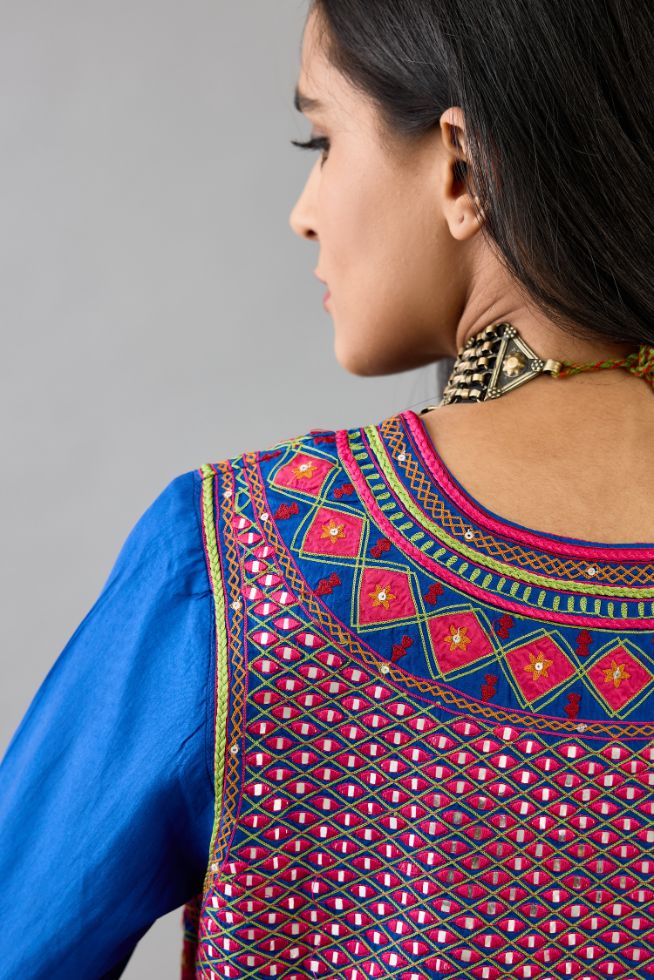 Blue silk embroidered kurta dress with V neck, yoke and fine gathers at empire line.