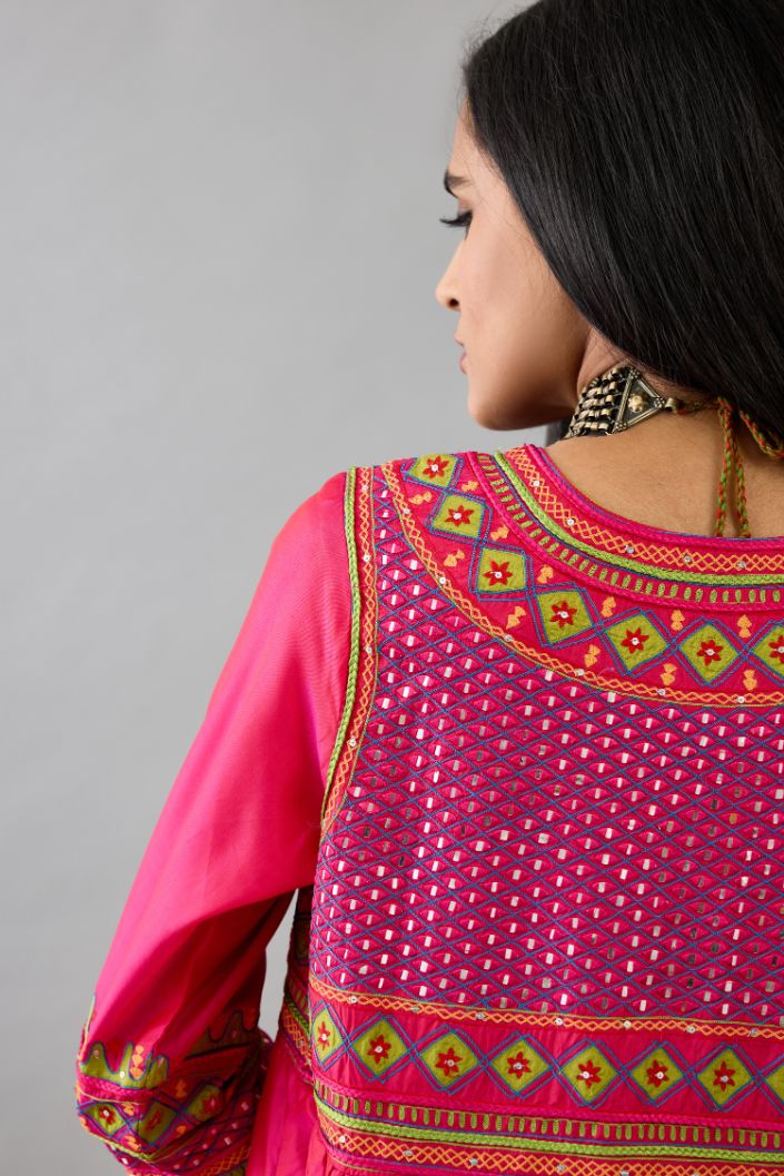 Fuchsia silk embroidered kurta dress with V neck, yoke and fine gathers at empire line.